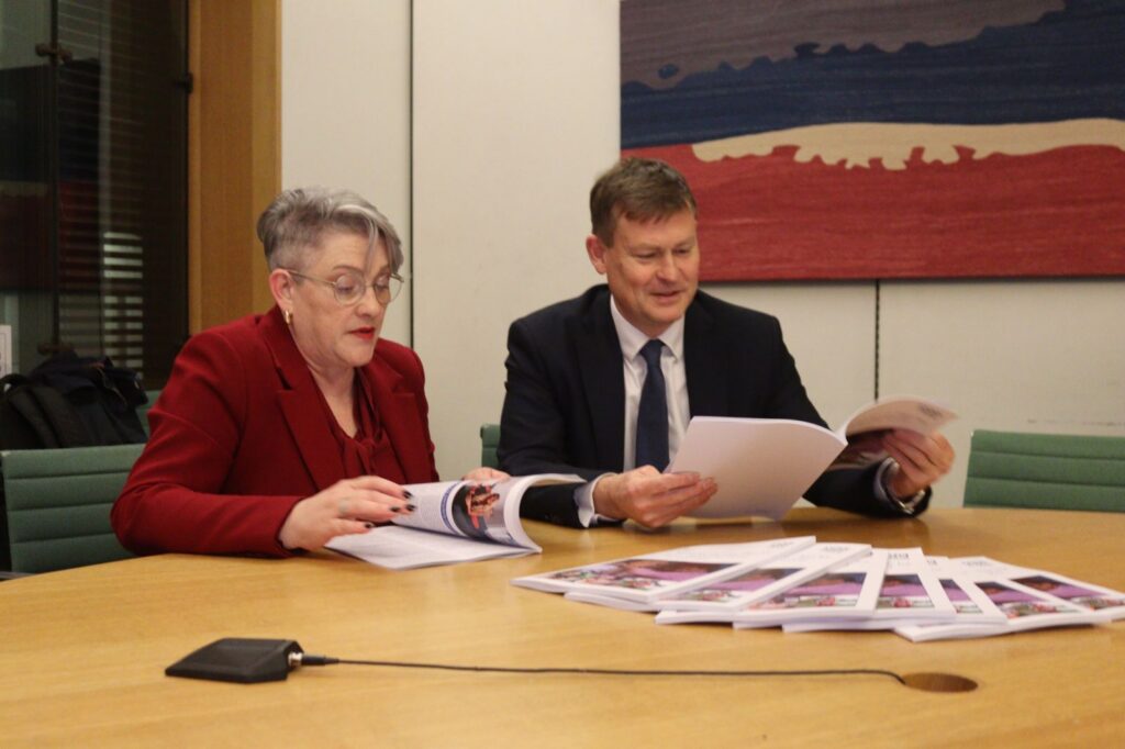 Justin Madders MP looks through the National Cancer Plan with Ashley Dalton MP, Minister for Public Health and Prevention.
