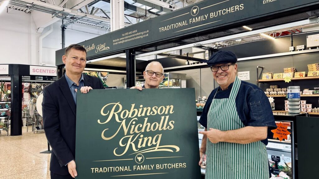 Justin Madders MP had a go at sausage-making when he visited the new butcher's, deli and greengrocer's in the revamped Ellesmere Port Market.